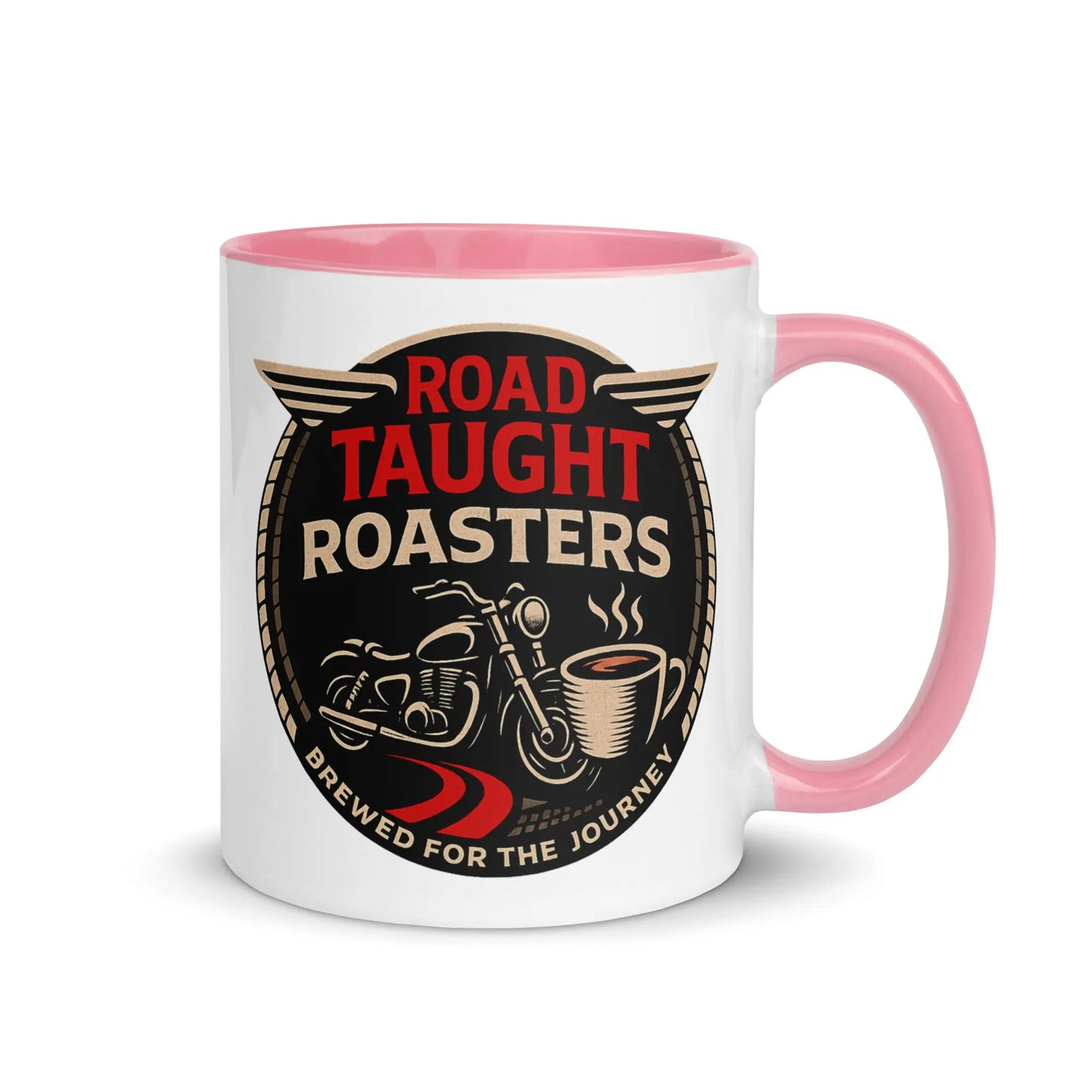 White coffee mug with pink handle featuring 'Road Taught Roasters' design 